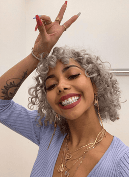 A girl is showing her platinum teeth - Gold Teeth USA